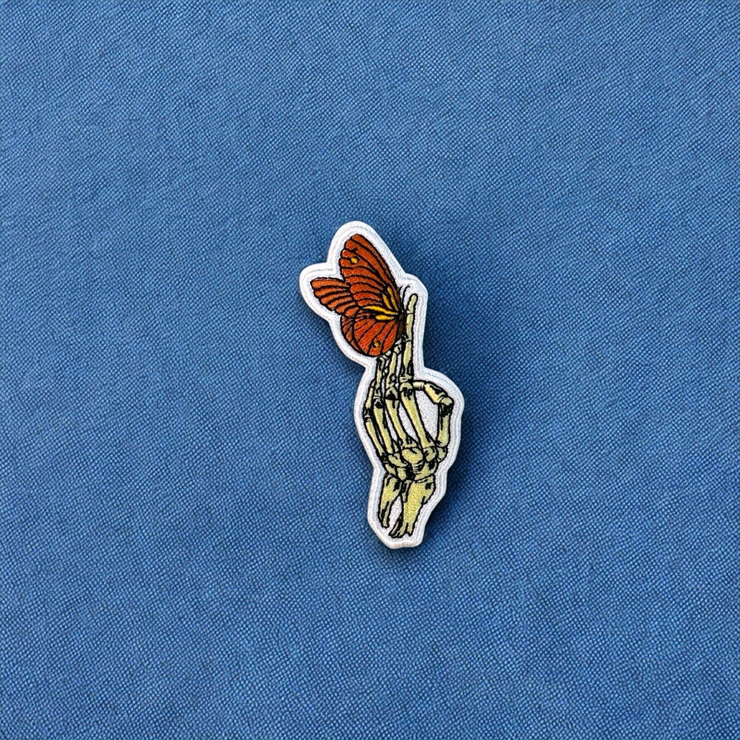 Skeleton Hand Orange Butterfly Patch