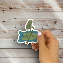 Load image into Gallery viewer, Frog Paddleboarding On A Lily Pad Sticker (M21)
